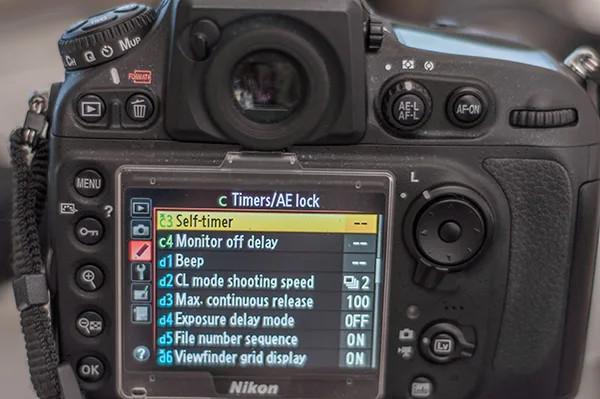 how to use timer on DSLR camera